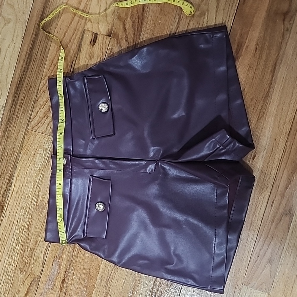Faux leather burgundy shorts.